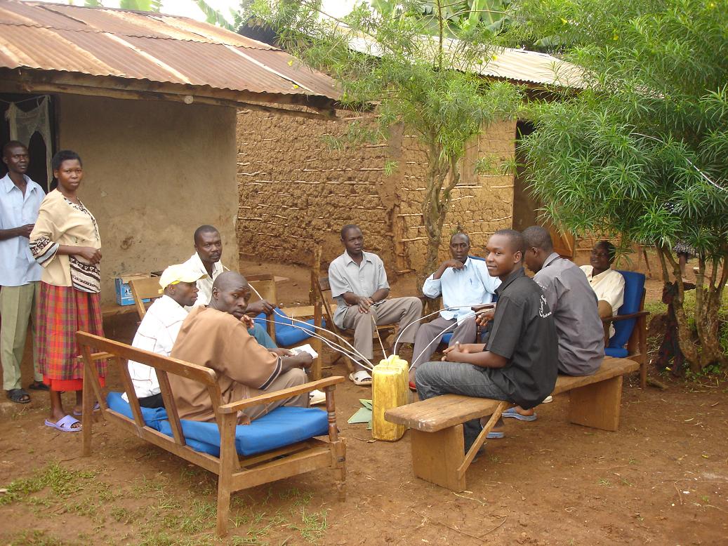 A family in Mbale partakes of malwa in their home compound in Sironko