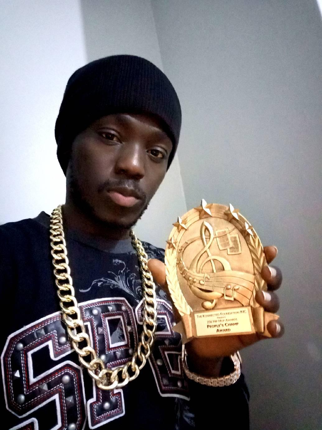 Judas Rap Knowledge with his Peoples Champ accolode