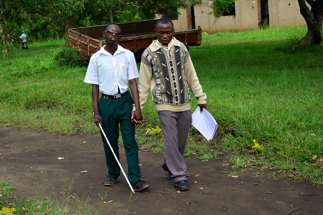 Masereka and a friend head home after school. 111